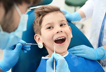 Little boy smiling during dental exam